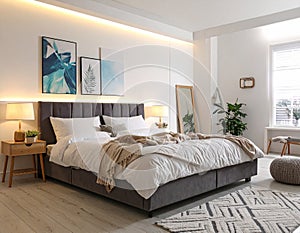 Stylish modern room interior with comfortable double bed
