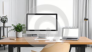Modern computer and laptop on wooden desk in room. Interior design