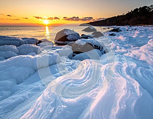 Frozen Rocks by the Sea at Sunset â Winter Landscape Photography