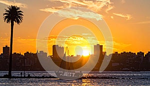 Generated image.Silhouette of an old shipwreck at sunset in Montevideo, Uruguay.