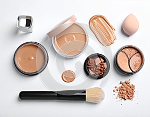 Assorted makeup products on a white background