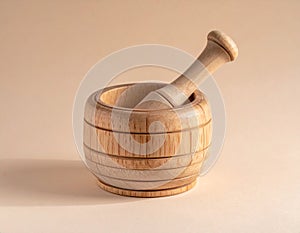 Wooden mortar and light brown background, closed