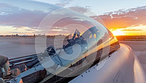 Fighter Jet Cockpit with Pilot at Sunset
