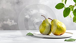 Two ripe pears on the gray table, shut up. Text area