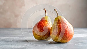 Two ripe pears on the gray table, shut up. Text area