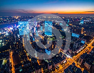 Futuristic Cityscape with Holographic Data Overlays at Dusk