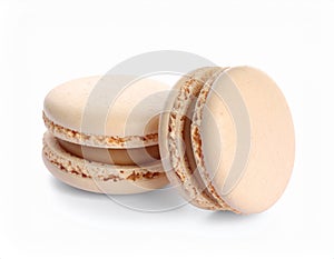Beige macaron isolated on white. Delicious dessert
