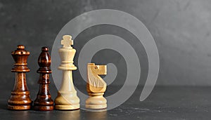 Different chess pieces on dark background. Space for text