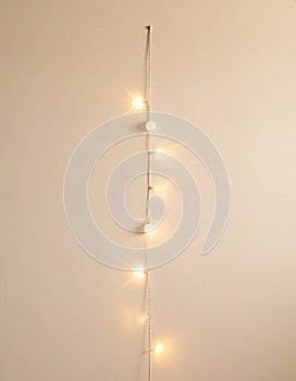 Single String of White Lights on Beige Wall
