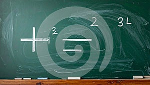 Simple arithmetic number sentence on blackboard