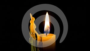 Burning Candle Flame with Melting Wax on Dark Background - Serene Light and Hope