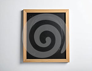 One blank small blackboard on white wall