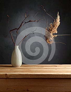 Empty wooden table top and colored dark or gray wall background for showing products