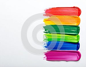 Rainbow paint strokes on a white background