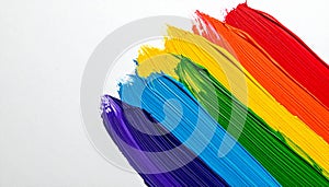 Rainbow paint strokes on a white background
