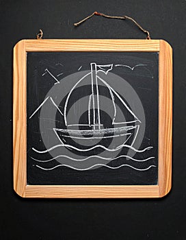 Boat drawing on blackboard blackground