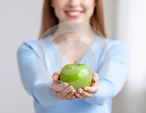 Offering a Fresh Green Apple