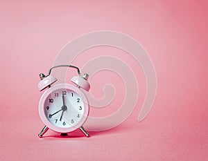 Pink Alarm Clock on Pink Background