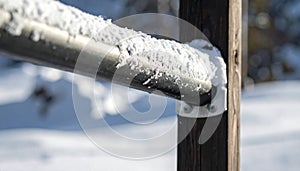 Frosty Snow on a Metal Handrail in Winter