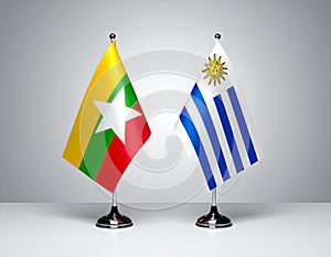 Myanmar and Uruguay flags the relationship with the table, gradient background. Vector