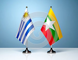 Myanmar and Uruguay flags the relationship with the table, gradient background. Vector
