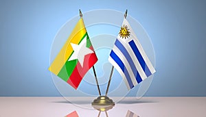Myanmar and Uruguay flags the relationship with the table, gradient background. Vector
