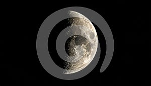 The moon over dark black sky at night