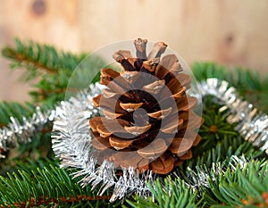 Christmas tree with a pinecone in tinsel