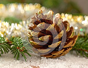 Christmas tree with a pinecone in tinsel