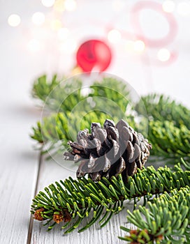Christmas tree with a pinecone in tinsel