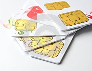 A stack of SIM cards displayed on a white surface