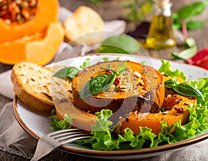 Pumpkin dish with a salad and biscuits