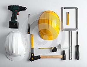 Various construction tools are arranged on a white background