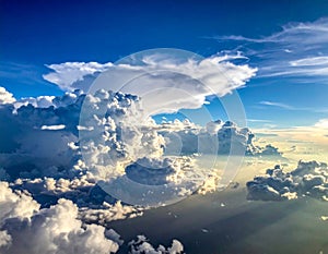 Dramatic cloudscape featuring towering cumulus clouds against a deep blue sky