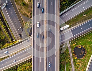 Aerial view of a complex highway interchange featuring multiple roads