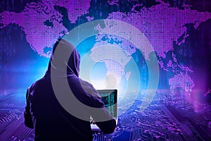 Hacker initiating global cyber attack using laptop in server room