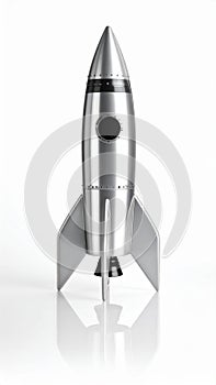 Metallic rocket ship model isolated on white background.