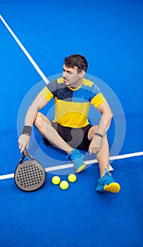 Open Tour template. Padel tennis player on the blue court background outdoors. Paddle tenis template for bookmaker photo