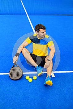 Open Tour template. Padel tennis player on the blue court background outdoors. Paddle tenis template for bookmaker photo