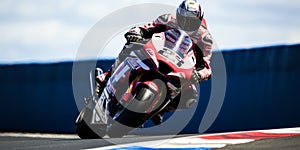 The Thrill of MotoGP Racing A Rider and Motorcycle in Full Flight photo