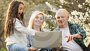 Generation Family On Grass Together in the garden