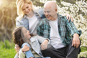 Generation Family On Grass Together in the garden