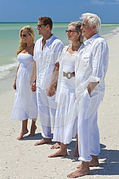 Generations of Family Holding Hands on a Beach