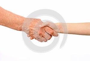 Generations - grandmother and grandchild handshake