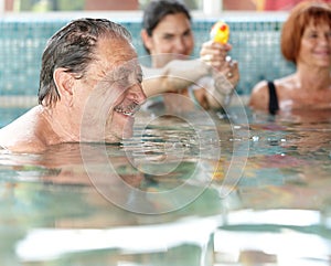 Generations having fun at swimming pool