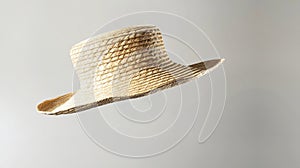 Generative AI Boater straw hat flying  in studio Concept of fashion clothing accessories and beach holiday photo