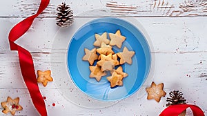 Generative AI Christmas composition layout with ginger cookies in form of stars in blue plate with red ribbon fir