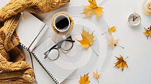 Generative AI Workspace with golden maple leaves notebook coffee cup wrapped in scarf  glasses Stylish office desk