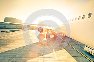 Generic airplane on terminal gate ready for takeoff at airport