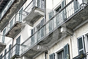 Generic balconies on an old house Italy desaturated slightly artistically photo